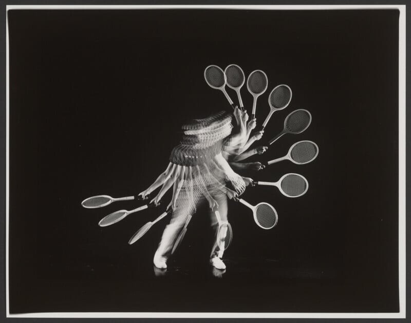 A black and white photo shows a tennis player in motion, captured multiple times in one image.