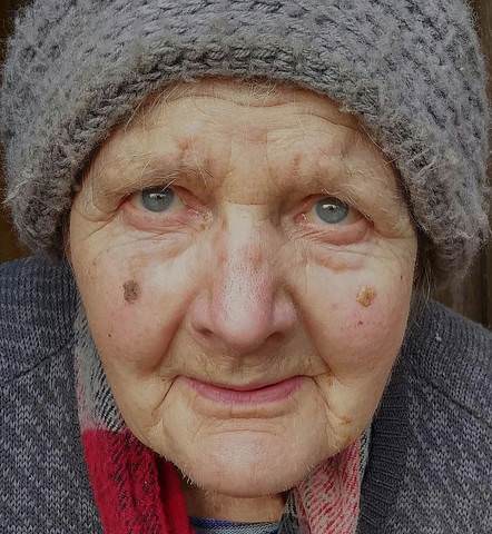 Portrait of a old lonely woman.
