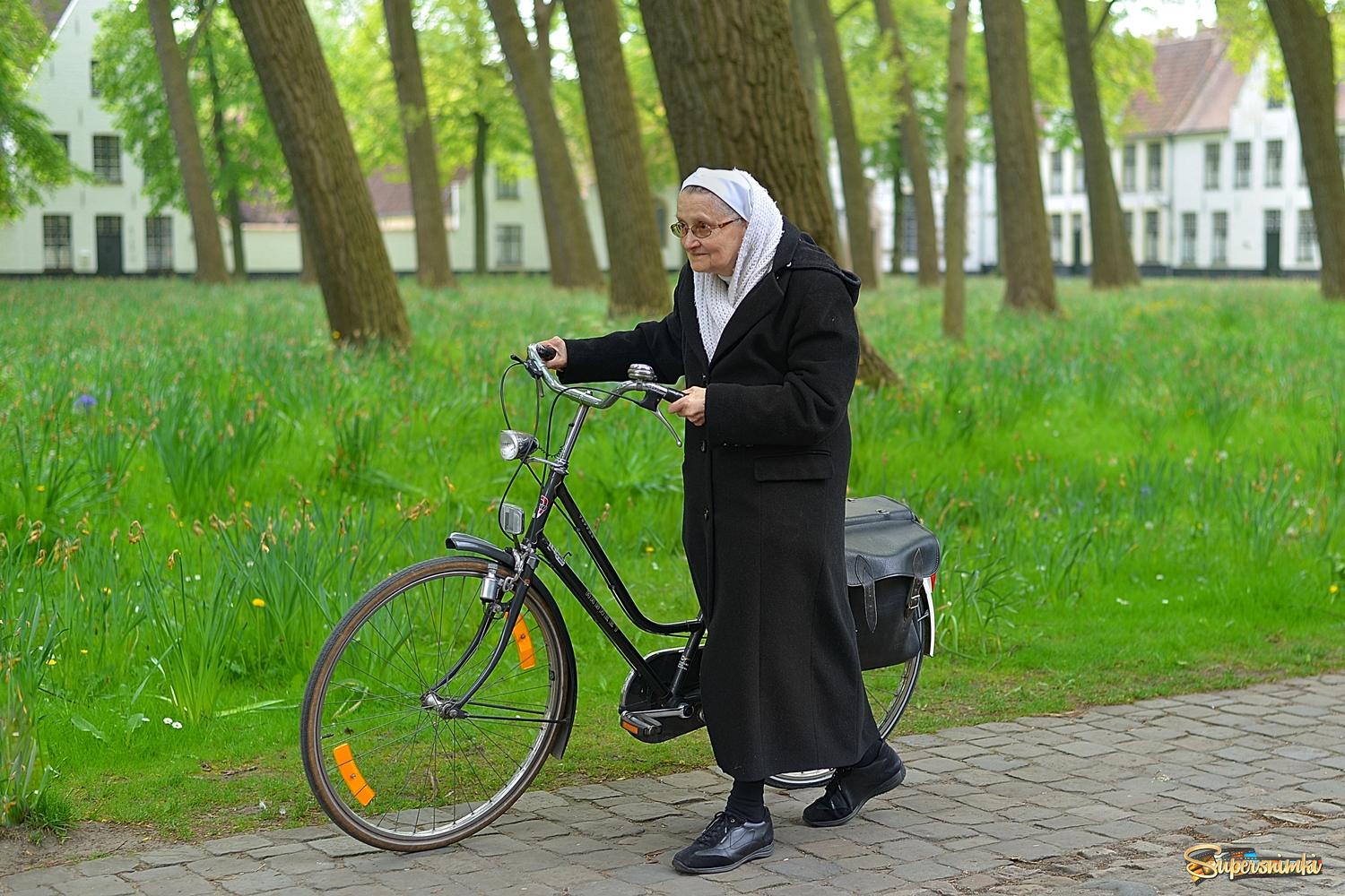 The biking beguine of Bruges.