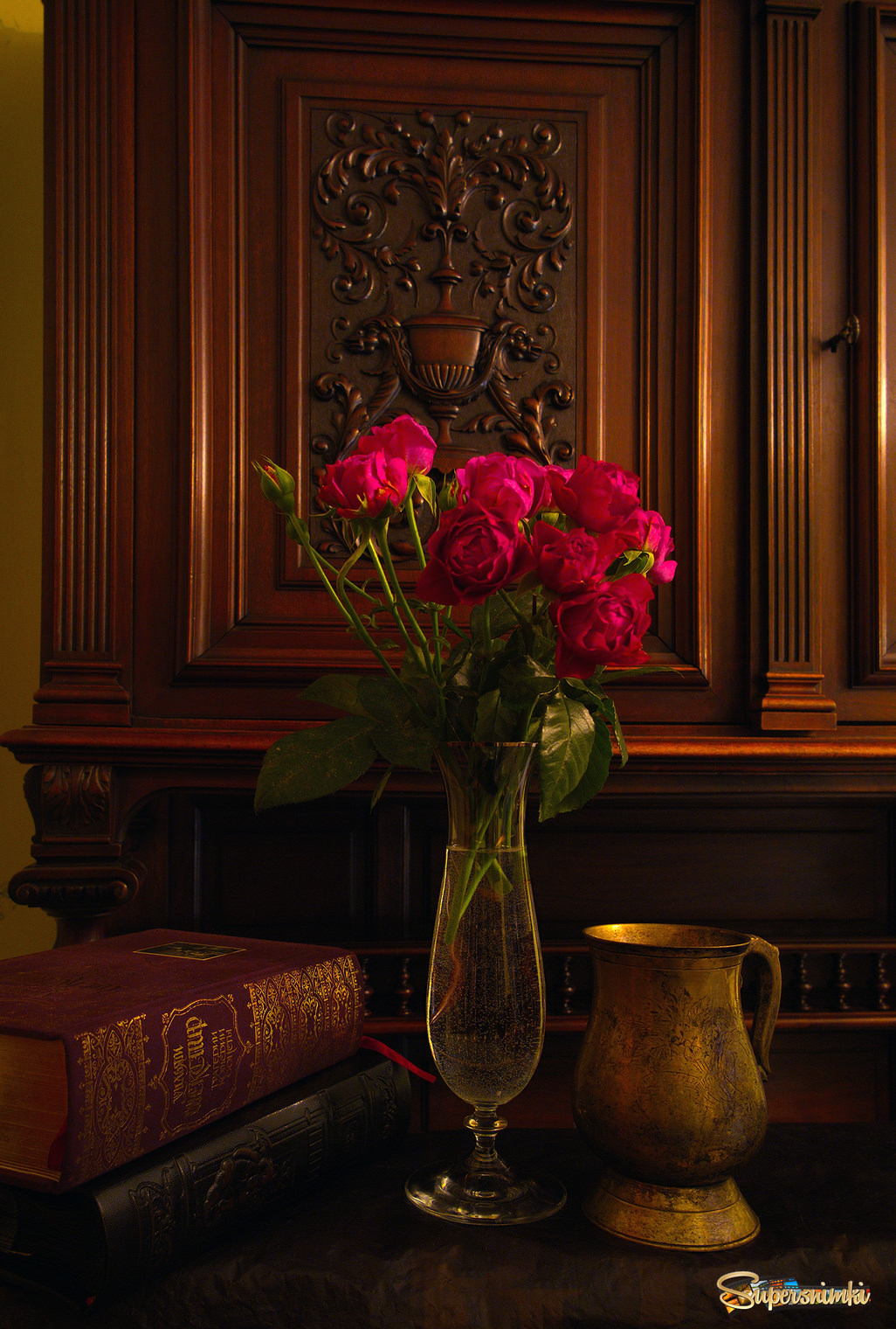 With roses, books, and antique bowl