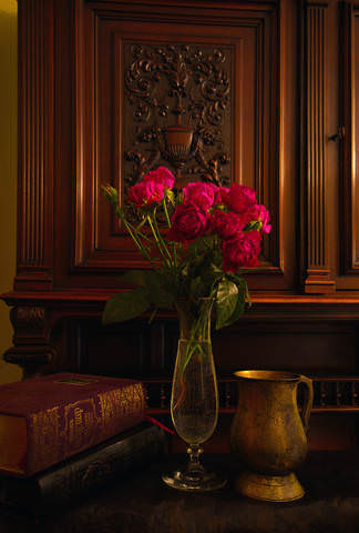 With roses, books, and antique bowl